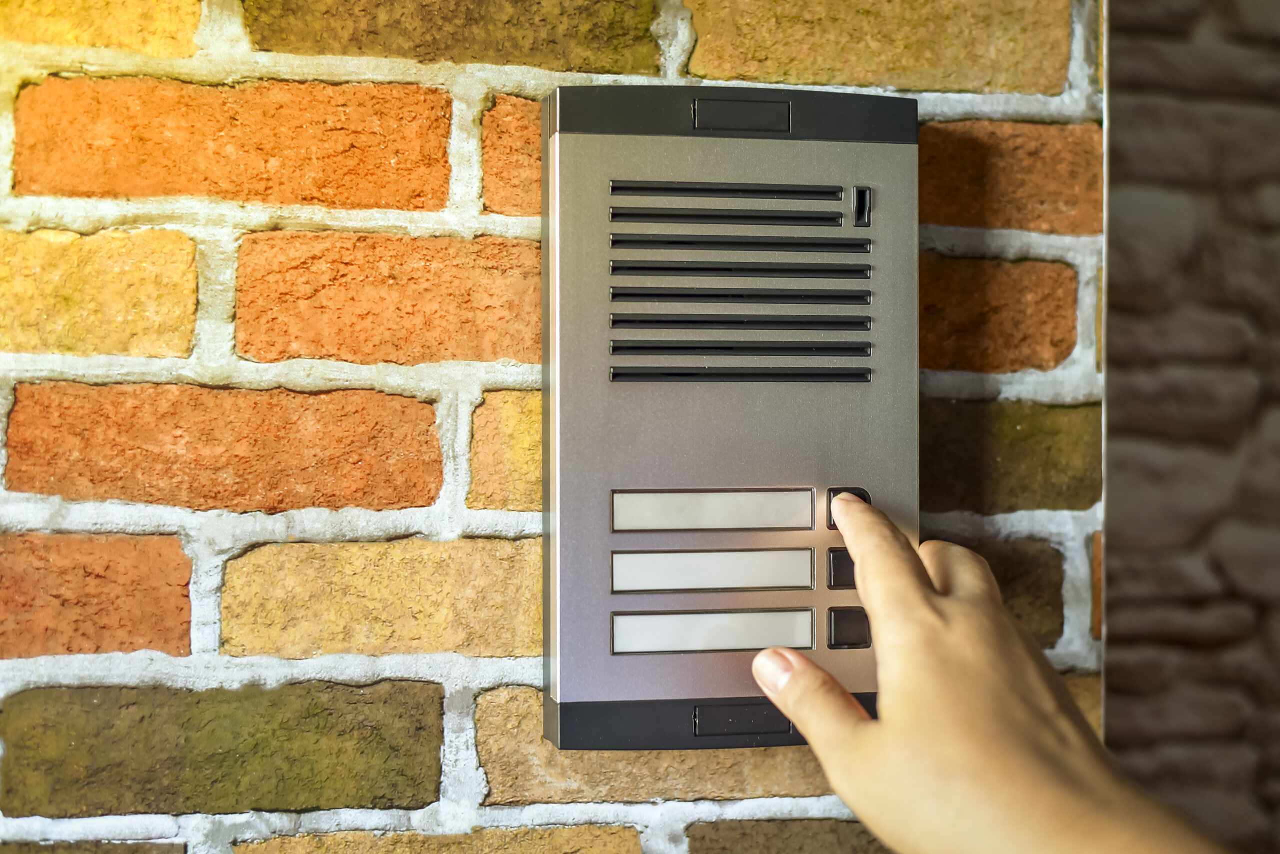 close up of woman using intercom at building entra 2023 11 27 05 03 32 utc
