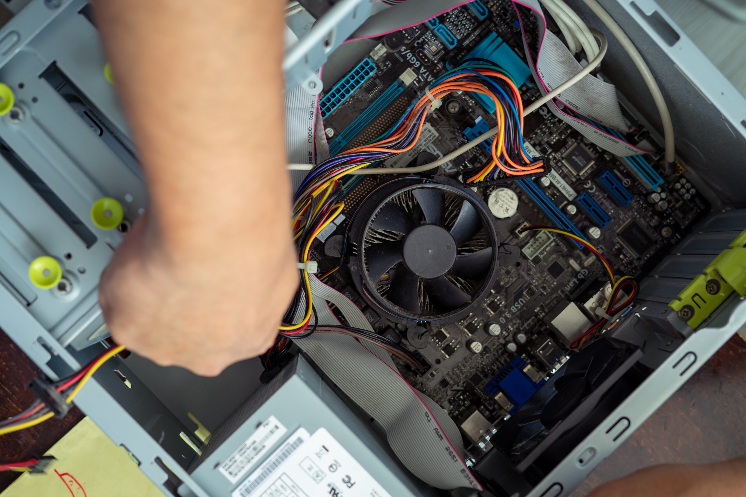 top view of hand fixing computer cpu maintenance 2023 11 27 05 27 11 utc 1